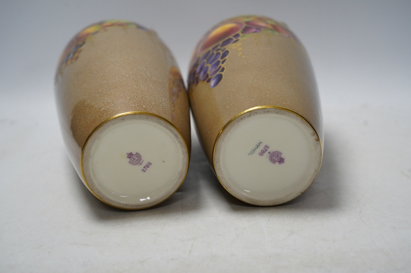 A pair of Worcester vases, decorated with fruit and berries, model number 2768, 26cm. Condition - good